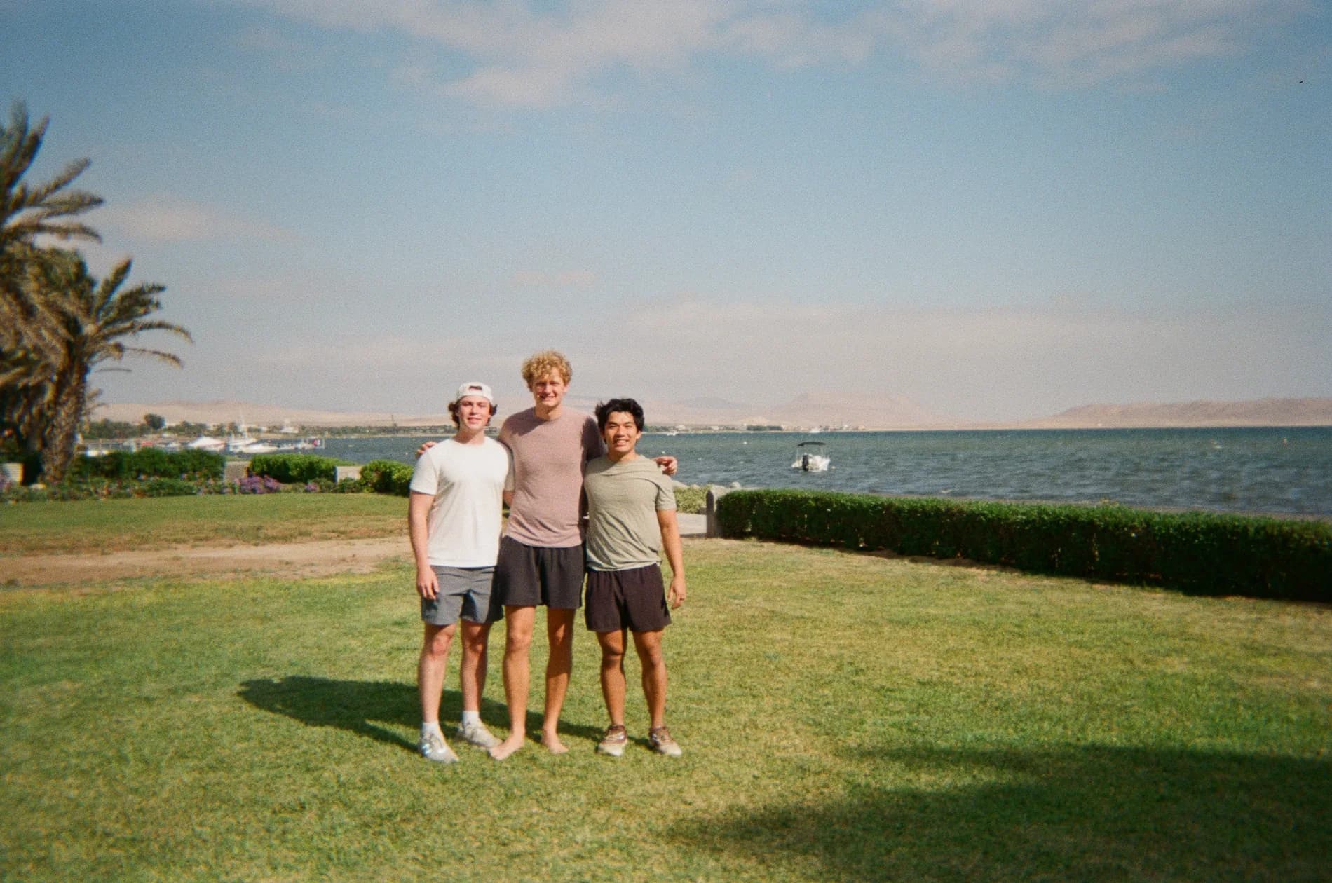 Zach traveling with friends by the water